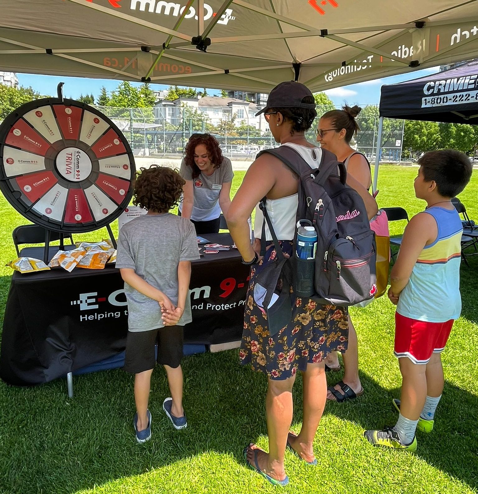 Communications Manager Kaila Butler sharing important 9-1-1 information with visitors at Collingwood Days on July 23 in Vancouver.