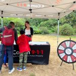 Communications Specialist Martina chatting with visitors at the Children's Safety Scavenger Hunt in Vancouver on August 26. Communications Specialist Martina chatting with visitors at the Children's Safety Scavenger Hunt in Vancouver on August 26. A father is helping his son drawing a message for our 9-1-1 heroes on the poster boards.